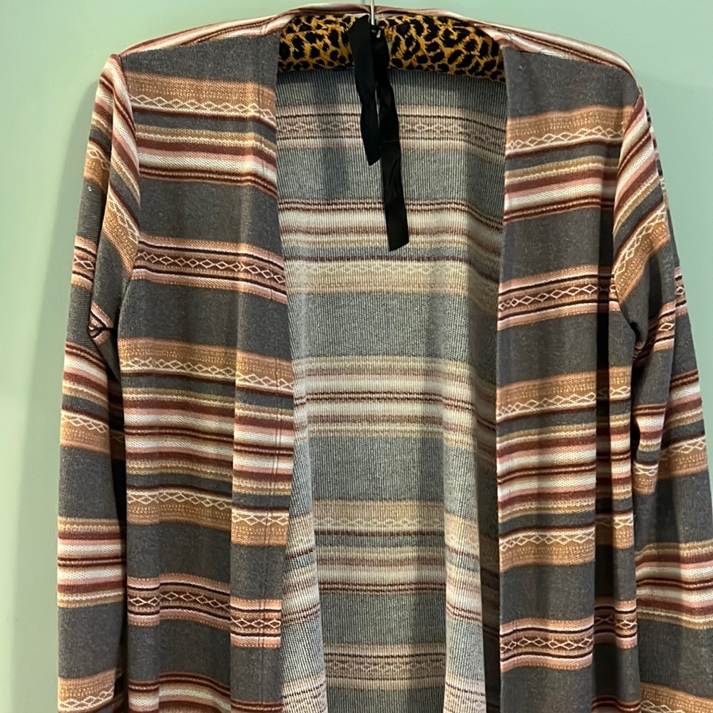 Large woman’s long sleeved cover up. Purple pink and tan stripes
